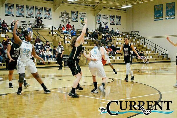CALLING FOR THE PASS – Fulton County High School Lady Pilot TaKyiah McNeal calls for a pass from teammate Callie Coulson during their game versus Carlisle County March 13. (Photo by Barbara Atwill)