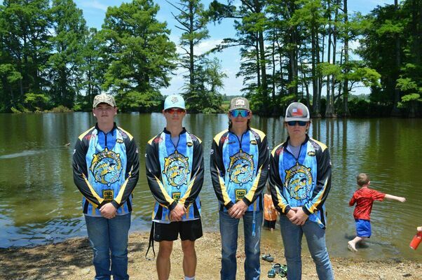 LENDING A HAND - The Fulton County High School Bass Club members Logan Johnson, Remington Stewart, Tommy Thomas, Carson Parker, and Will Jackson and Will's cousin from North Carolina, Caden Wood volunteered their time to help with the Hickman Recreation Tourism Convention Commission at Hamby Pond on June 5 Bass club coaches Wes Moore and Will Greer also helped. (Photo by Barbara Atwill)