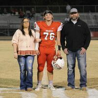 SFHS FOOTBALL SENIOR NIGHT -- Braden Costello, along with his parents, was recognized during the Red Devils Senior Night at the Oct. 21 football game. Costello is a senior member of the Red Devils football team. (Photo by David Fuzzell.)