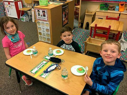 South Fulton Elementary School’s Preschool class took the opportunity during last week’s celebration of all things reading and Dr. Seuss to try out a popular treat worthy of Cat In The Hat cuisine, Green Eggs and Ham, sweetened up with sprinkles and a wafer cookie.
