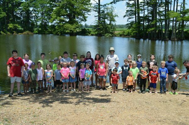 LARGE GROUP OF PARTICIPANTS - Hickman Recreation Tourism Convention Commission held their annual Fishing Rodeo at Hamby Pond below Hickman on June 5. There were 48 youngsters from the age of 0 - 15 participating in the rodeo and winning. prizes. (Photo by Barbara Atwill)