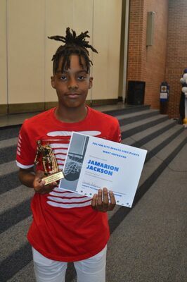 FULTON MIDDLE SCHOOL BASKETBALL AWARD PRESENTED -- The Most Improved Award was presented to Jamarion Jackson, Fulton Middle School Basketball Team member, during the Fulton Middle/High School Sports Awards Banquet held May 12. (Photo by Benita Fuzzell.)