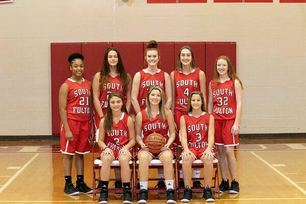 SOUTH FULTON HIGH SCHOOL 2020-2021 LADY RED DEVILS BASKETBALL TEAM – Front Row, left to right, #2 Aubree Gore, #1 Halle Gore, #3 Anna Gore; back row, # 21 Cashaya Mclerkin, #24 Addison Wilson, #15 Kailey Mayo, #4 Abbi McFarland, and #32 Katie Barclay. (Photo by Jake Clapper)