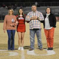 SFHS SENIOR NIGHT -- Addison Wilder, a senior South Fulton High School Cheerleader, along with her parents, was recognized during Senior Night at the SFHS vs. McEwen football game Oct. 21. (Photo by David Fuzzell.)