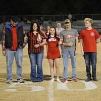 SENIOR CHEER RECOGNITION -- Ellen Colston, a senior Cheerleader, along with her parents, was among seniors  recognized during the Oct. 21 Senior Night ceremony at the SFHS football game. Colston was also recognized as a senior member of the SFHS Band. (Photo by David Fuzzell.)