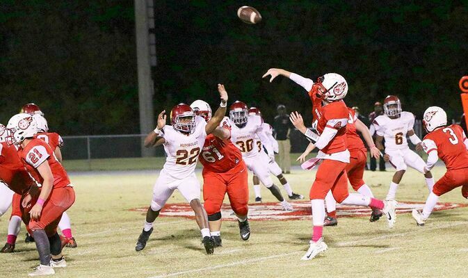 Humboldt’s Isaiah Agnew (22) tries to defend a pass by South Fulton quarterback Bryce McFarland (4), during the first quarter of play last Friday night. McFarland threw touchdown passes to Rider Whitehead and Beau Britt, and helped guide the Red Devils to a 20-8 Homecoming win over the Vikings. (Photo by Charles Choate)