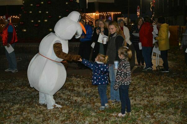 ENJOYING A DANCE - A young participant at Fulton Tourism's Christmas in the Park on Dec. 4, enjoyed a dance with Olaf, prior to the lightening of the Christmas tree. (Photo by Barbara Atwill)