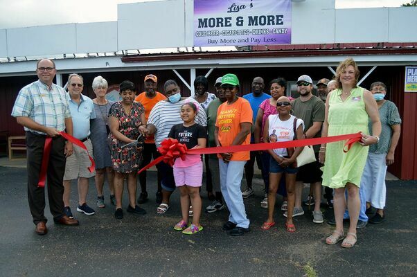 A large group of family, friends and Chamber members were on hand for last week’s Ribbon Cutting for Lisa’s More & More. (Photo by Benita Fuzzell)