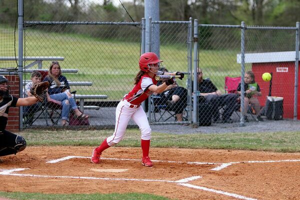 BATTER BUNT – South Fulton Lady Red Devil Aubree Gore goes for the bunt during Friday evening's home field match up against visiting Trenton. The Lady Devils came out on top, allowing just one run, and beating Trenton 11-1. (Photo by Jake Clapper)