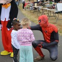 SPIDEY MOMENT - Spiderman takes time to talk with two little youngsters at the Hickman Pecan Festival held Oct. 22, at Jeff Green Memorial Park in Hickman. (Photo by Barbara Atwill)