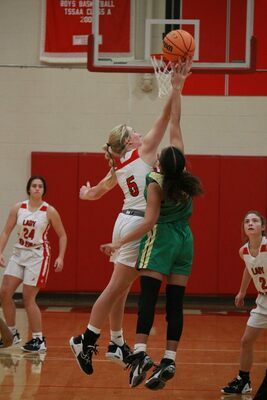 Lady Red Devil Maddie Gray rose to the occasion against a Lake County Lady Falcon during home court action Nov. 22. (Photo by Jackson Doss)