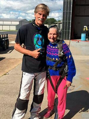 South Fulton’s Mattie Cook pauses with her skydiving instructor minutes before boarding a plane for her first skydiving experience. (Photo submitted)