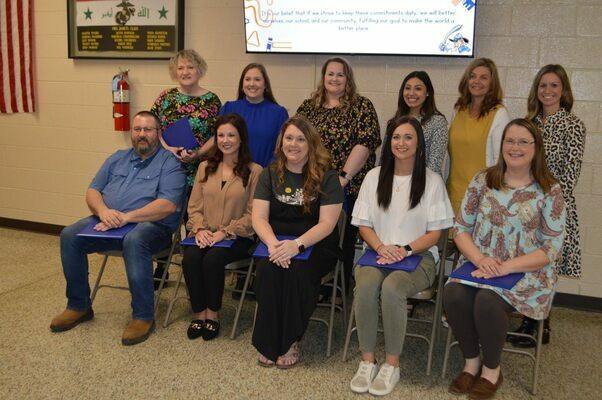 SOUTH FULTON EDUCATORS AMONG OBION COUNTY SCHOOL SYSTEM’S BUILDING LEVEL TEACHERS OF THE YEAR – Areli Frields, back row, fourth from left, Kristy Vincent, fifth from left, and Carmen Barclay, sixth from left, were among teachers recognized during the Obion County Board of Education meeting March 6. All were awarded Building Level Teacher of the Year at South Fulton Elementary, Middle and High School. Frields received the honor for grades PreK-4, Vincent received the honor for grades 5-8, and Barclay received the honor for grades 9-12. Others recognized included Melissa Jones, Black Oak, grades Pre-K-4, Ped Foster, grades 5-8; Carol Hames, Hillcrest, grades Pre-K-4, Meredith Mancell, grades 5-8; Jenny Crittendon, Lake Road, Pre-K-4, Casey Wade, grades 5-8; Tonya Cochran and Suzanne Hill, grades 9-12, Obion County Central; Lindsay Gidcumb, Ridgemont, grades Pre-K-4, Rachel Whites, grades 5-8; and Cheryl Ogg, South Fulton Middle/High, not pictured, grades 9-12.  (Photo by Benita Fuzzell.)