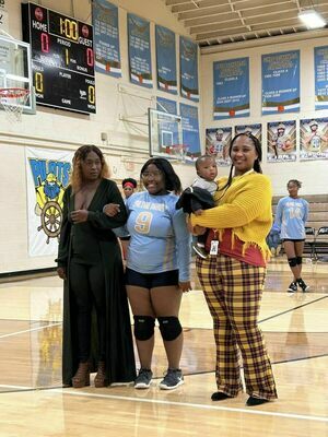 VOLLEYBALL SENIOR NIGHT – Arieyanna Cox, center, was recognized on Oct. 10 during Fulton County High School’s Volleyball Senior Night. (Photo submitted).