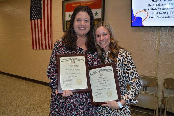OBION COUNTY SCHOOLS SYSTEM-WIDE RECOGNITION – Laura Pitts, left, and Carmen Barclay, right, were recognized during the Obion County Board of Education meeting Monday night, awarded system-wide honors of being named Obion County Schools’ Principal of the Year and Teacher of the Year for grades 9-12. Pitts is the Principal of South Fulton Middle/High School where Barclay teaches. (Photo by Benita Fuzzell)