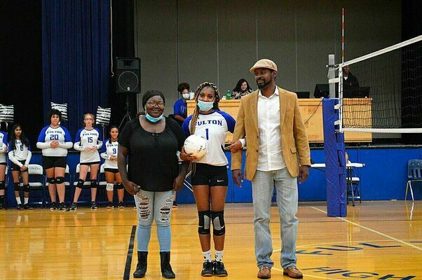 VOLLEYBALL SENIOR NIGHT – Senior Night for Fulton High School Volleyball players was held Oct. 14, at Fulton High. Senior Jasmine McCloyn, center, was escorted by Jessica Johnson and Nick McLCloyn. (Photo by Barbara Atwill)