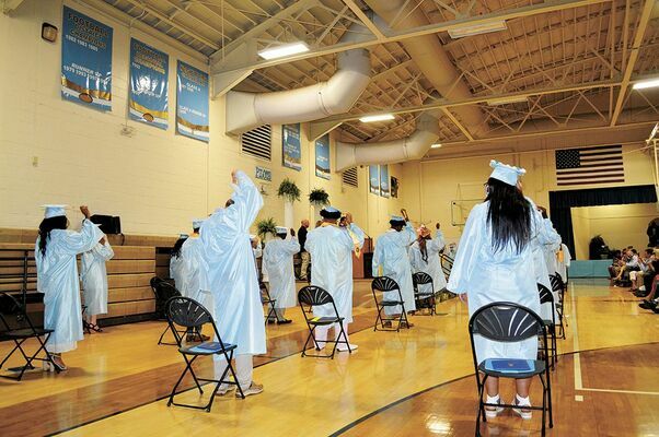 SPACED OUT FOR A SPECIAL CELEBRATION – Members of  the Fulton County High School Class of 2020 were able to participate in graduation ceremonies in their respective gyms, albeit in a socially distanced manner, with immediate family also present, seated in the bleachers. The  FCHS graduation, in the June 3 edition.