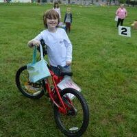 John Campbell Clark, 7, of Sedalia, was the winning ticket hold for a prize bike, in the age 7-10 category for boys.