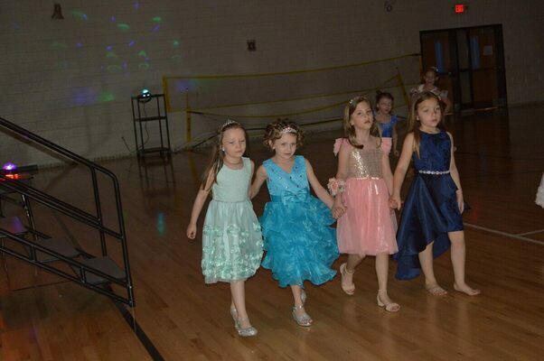 PRINCESSES ON PARADE - These four "princesses" marched on parade during the Ties and Tiaras Daughter and Dad Dance April 23 at Fulton County Elementary School. The event was sponsored by the Parent Teacher Student Organization. (Photo by Barbara Atwill