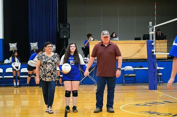 SENIOR NIGHT – Fulton High School held Senior Night for Volleyball Oct. 14. Senionr Madison Bartimus, center, was escorted by her parents Mike and Betty Bartimus. (Photo by Barbara Atwill)