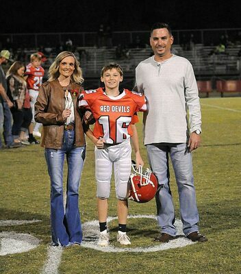 SOUTH FULTON EIGHTH GRADE NIGHT RECOGNITION –  Mason Parrish and his parents were among eighth grade football players honored during the Red Devils' Sept. 29 game against Dresden. (Photo by David Fuzzell)