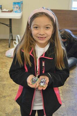 DOUBLE PRIZE WINNER - Two rocks were painted by Susan Caldwell-Black were placed in two separate eggs for Cayce United Methodist Church's Annual Easter egg hunt on April 9. Molly Linder found both eggs and was given the option to keep the rocks or trade for cash. She chose to trade and the rocks were collected and will be hidden again next year. (Photo by Barbara Atwill)