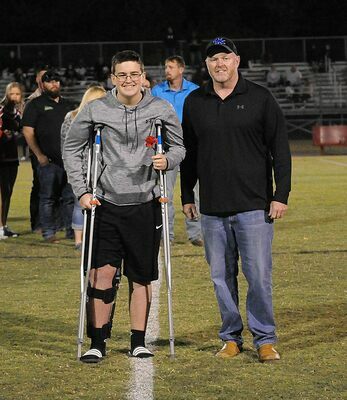 SFMS FOOTBALL EIGHTH GRADE NIGHT –  Gavin Dixon, along with his parents, was recognized as an eighth grade member of the South Fulton Middle School football team during Eighth Grade Night Sept. 29, at the SFMS versus Dresden football game. (Photo by David Fuzzell)
